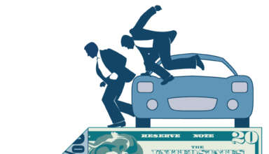 2 figurines jumping out of car with dollar bill & 1 corner folded with advertisement showing on the back