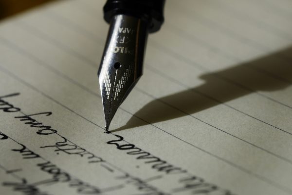 fountain pen writing on a paper