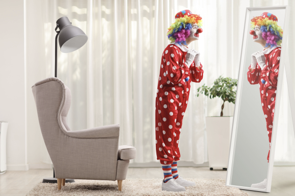 Clown looking in the mirror
