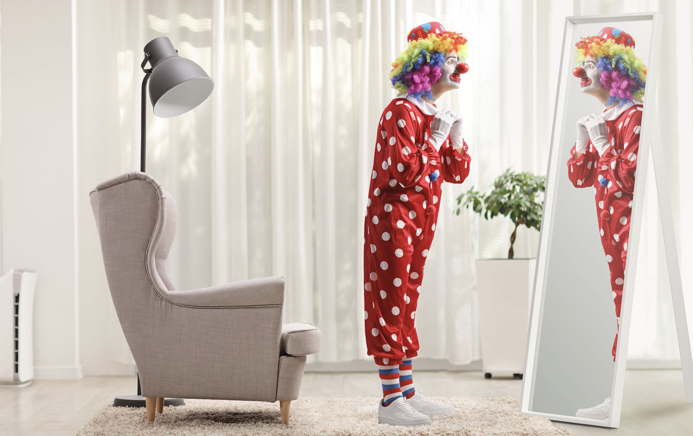 Clown looking in the mirror