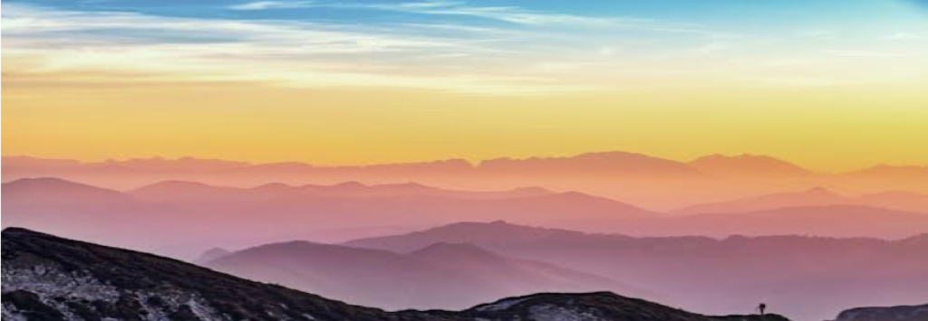 Sunset/Sunrise over cloudy mountains